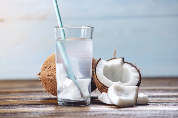 Coconut water and a cracked coconut
