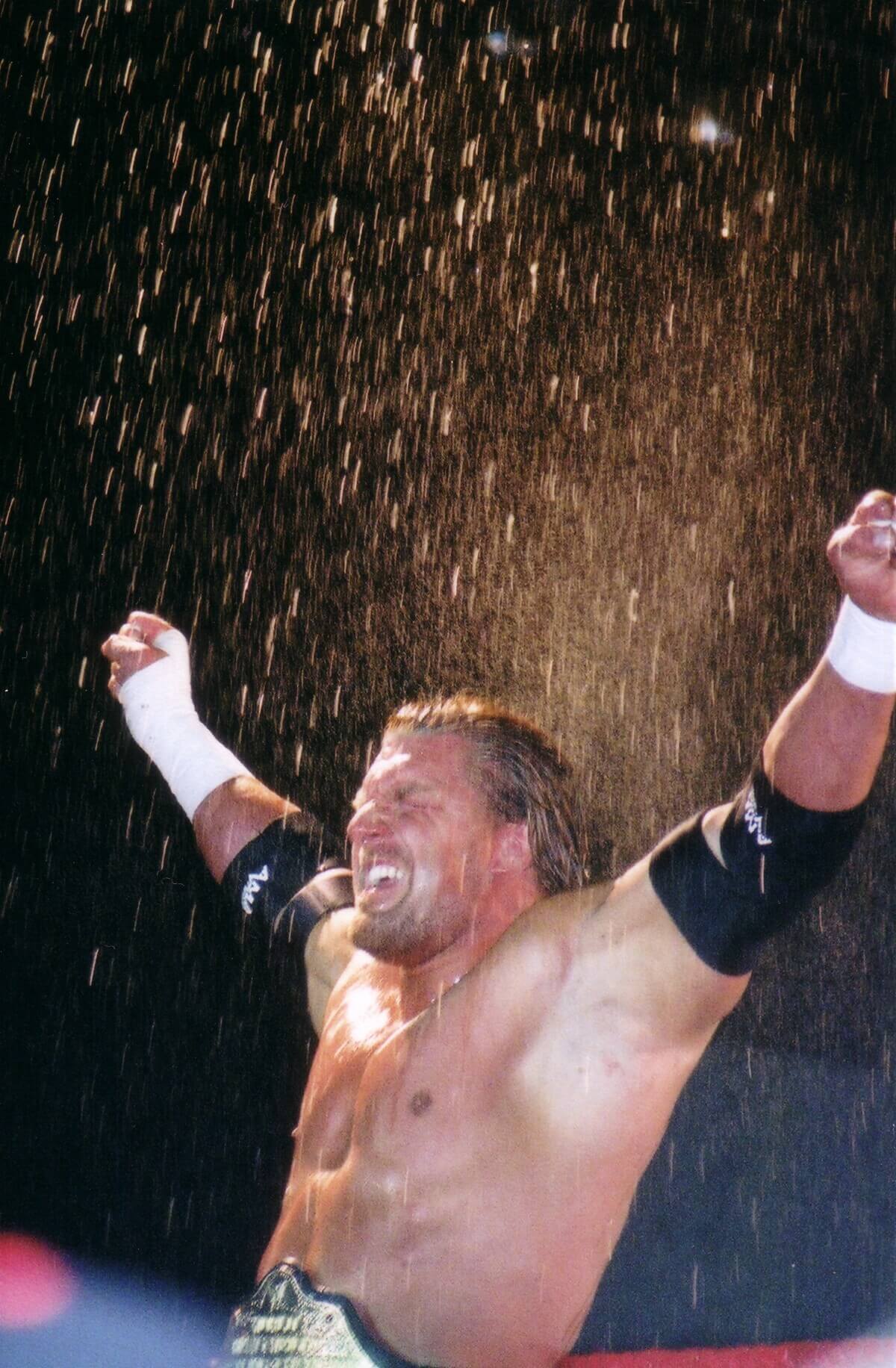 Triple H celebrating a WWE win