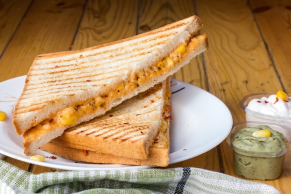 bread with cheese fillings on white ceramic plate
