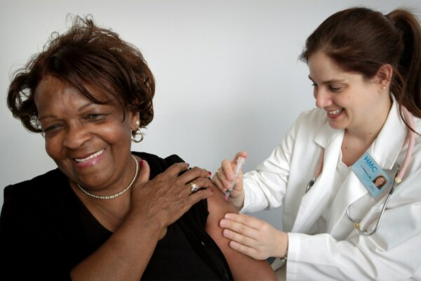 woman getting vaccine shot