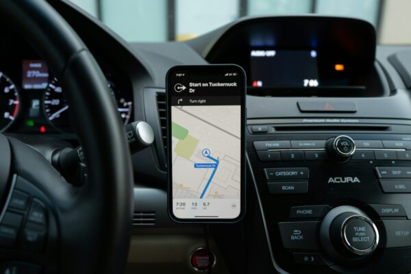 A phone mounted on a car's dash