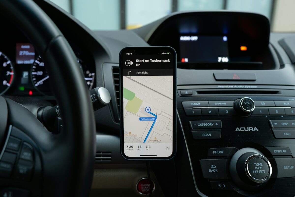 A phone mounted on a car’s dash