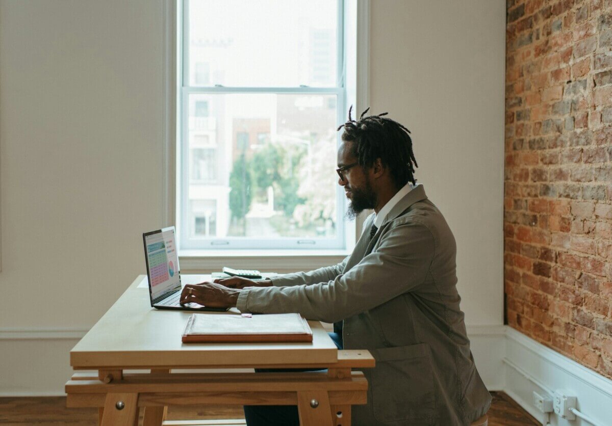 remote worker sitting by window