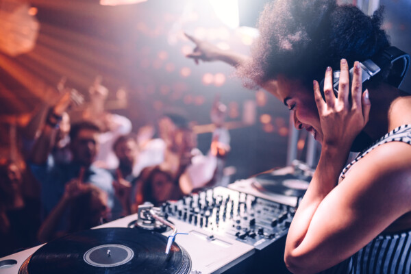 A DJ performing a set at a club