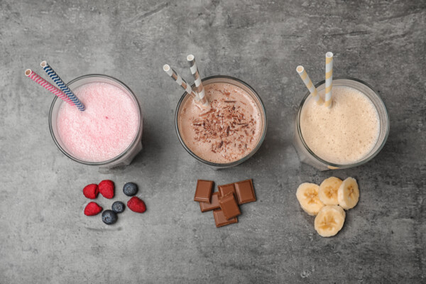 Meal replacement shakes with berries, chocolate, and bananas