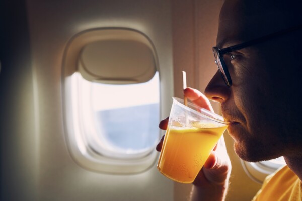 Passenger drinking alcohol during airplane flight