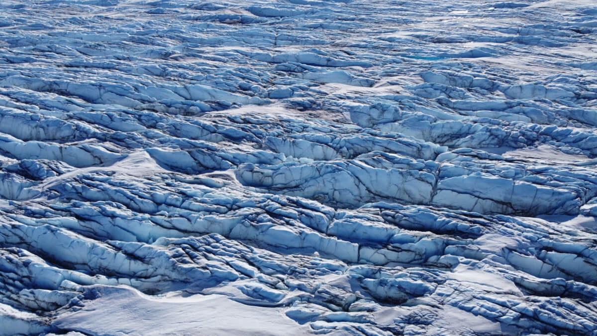 Part of the Greenland Ice sheet with blackened ice caused by algae