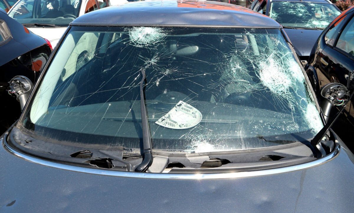 Windshield of a car severely damaged by hailstorm
