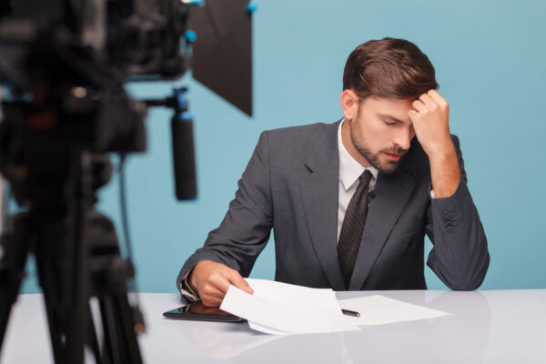 young tv reporter stressed out