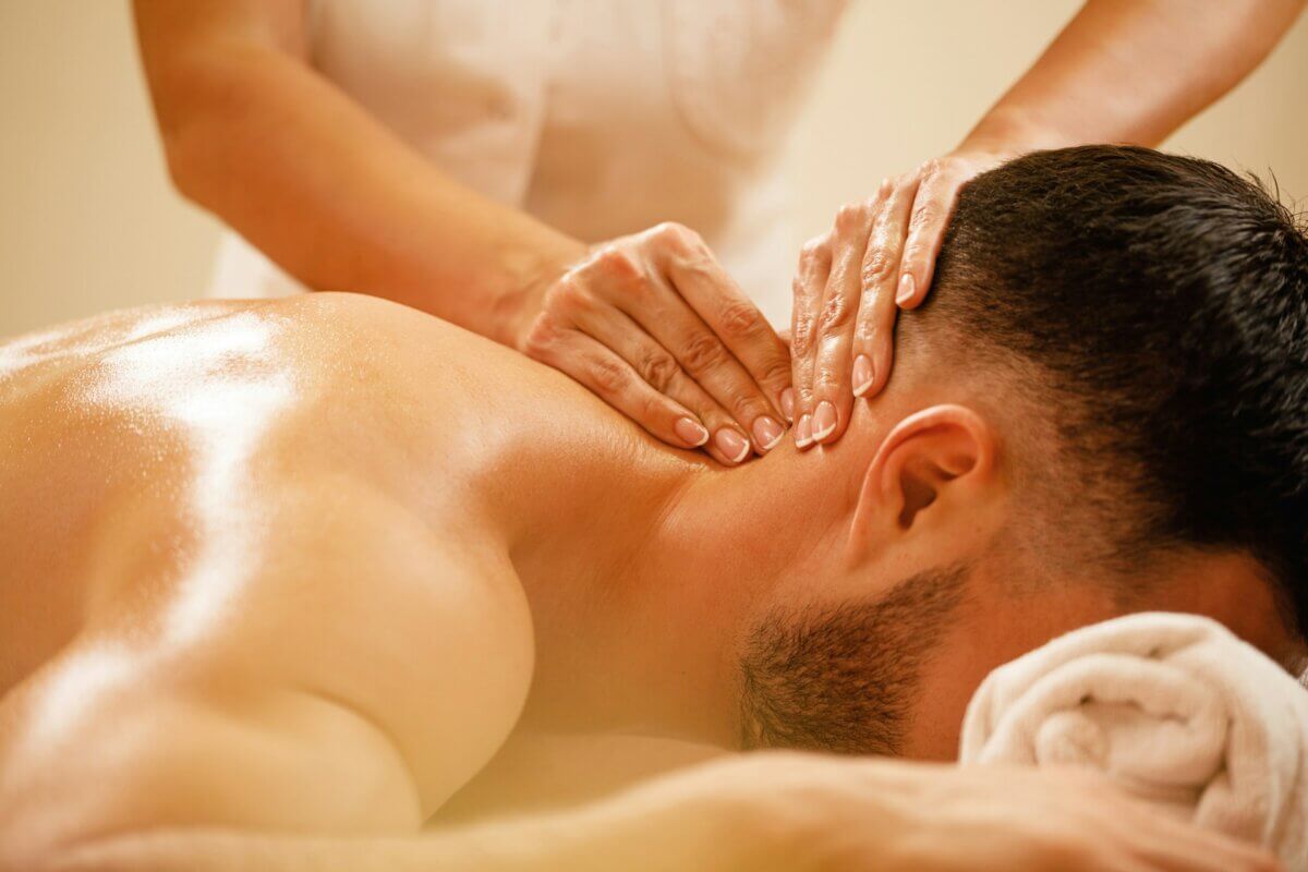 Man receiving a neck massage