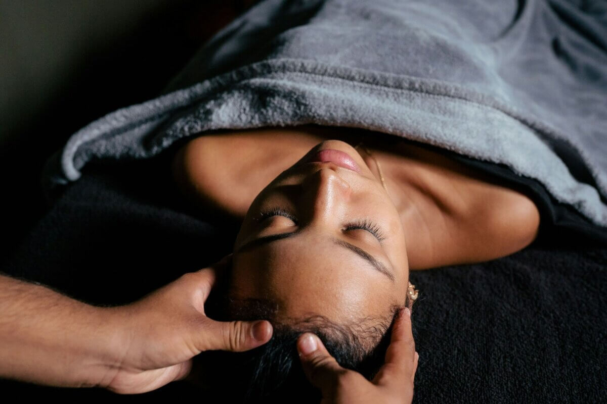 Woman receiving a scalp massage