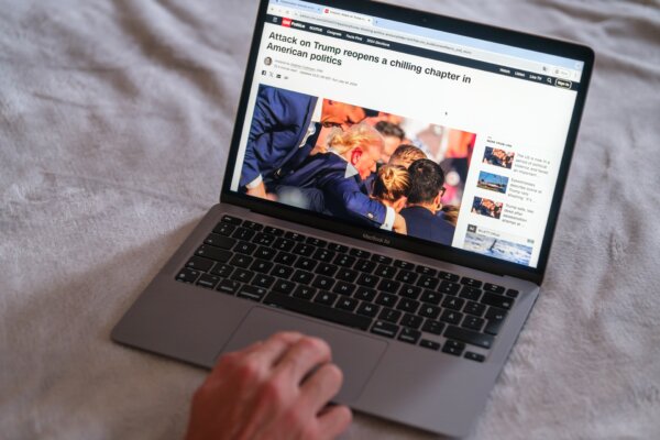 Man reading news about assassination attempt against Donald Trump