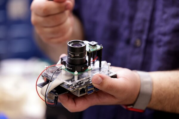 The round lens of PrivacyLens captures standard digital video while the square lens senses heat. The heat sensor improves the camera’s ability to spot and remove people from videos.