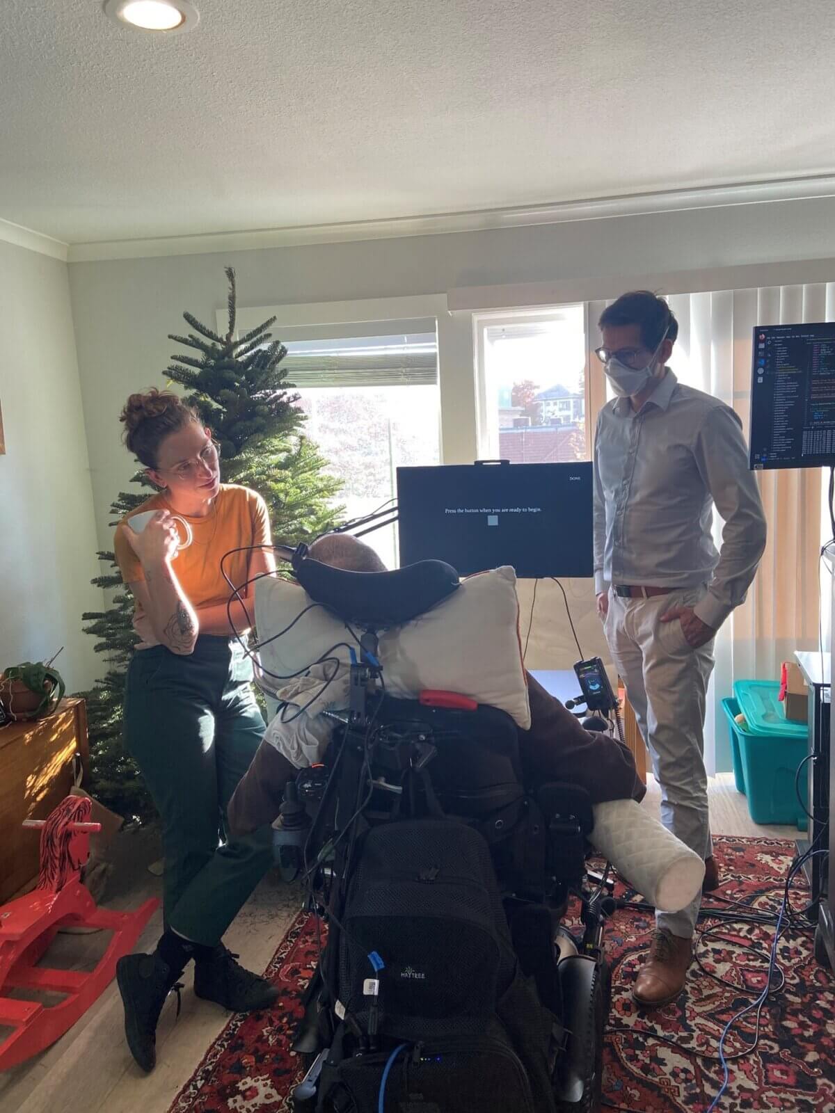 Casey Harrell with his personal assistant Emma Alaimo and UC Davis neuroscientist Sergey Stavisky