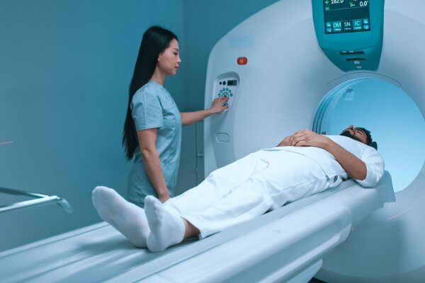 Doctor neurologist performing CT scan for patient