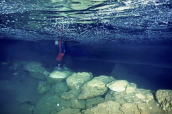 View of the submerged stone bridge from Genovesa Cave, Mallorca, Spain.