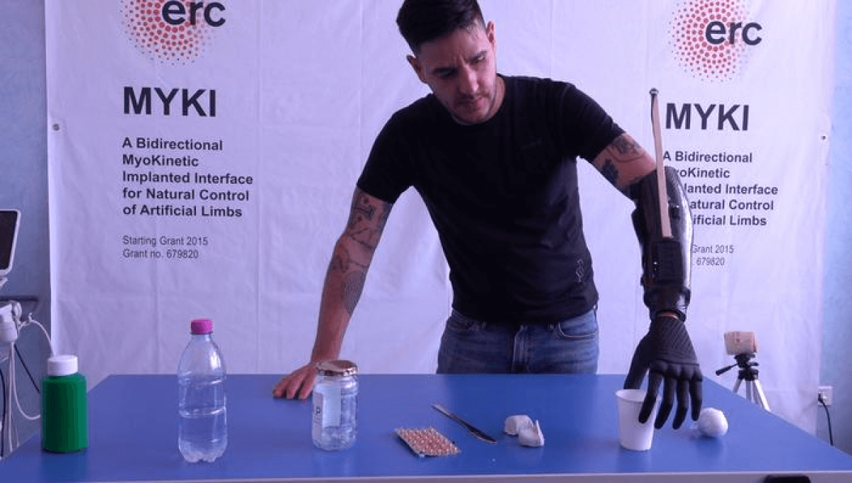 Experimental tests on robotic prosthesis: patient grasps a plastic cup