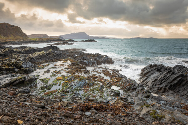 The rocky coastline of Seil with the Sound of Luing and the islands of Lunga, Garvellachs & The Black Isles