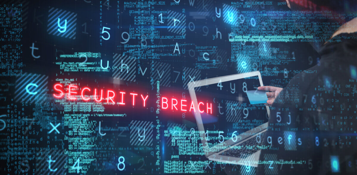 hacker using laptop and credit card