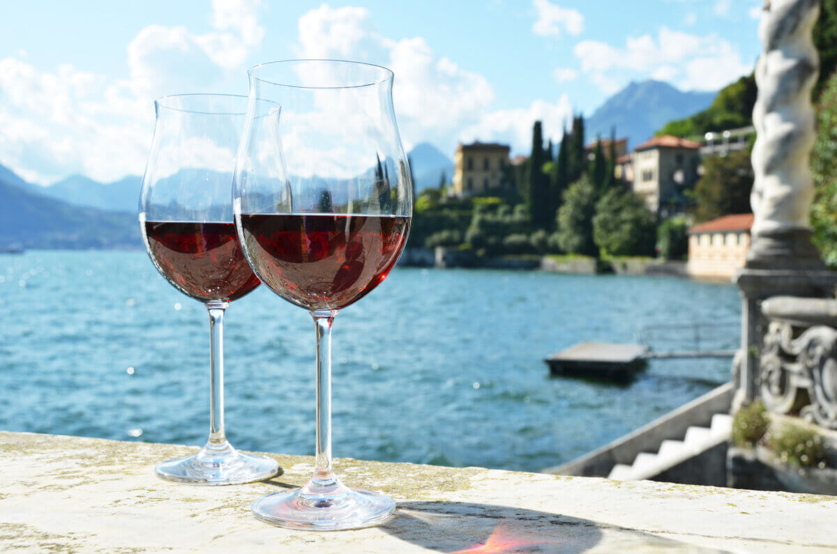 Two glasses of red wine at Lake Como in Italy