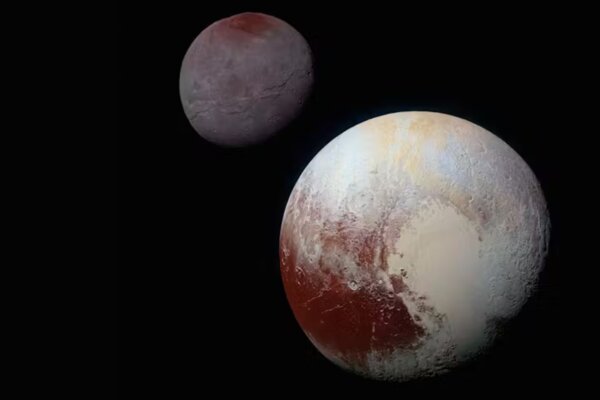 A composite of enhanced color images of Pluto (lower right) and Charon (upper left).