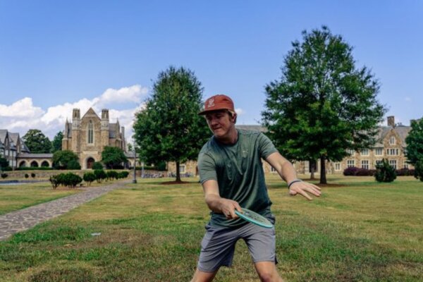 Undergraduate student Calvin Teague demonstrates an optimal thumb grip on a mid-range disc.