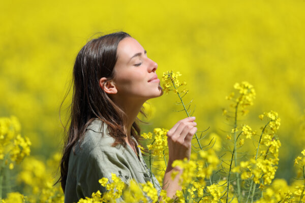 woman smelling flowers