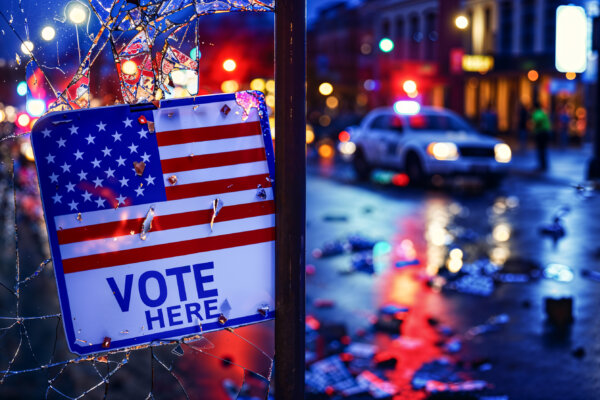 Civil unrest at polling place: Broken window with "Vote Here" sign for Election Day