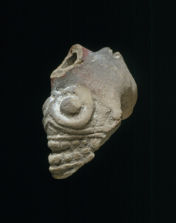 Skull pipe with broken mouthpiece. 