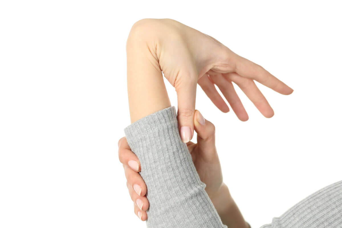 Flexible woman bending wrist and thumb