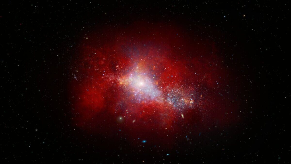This artist’s illustration shows a red, early-Universe dwarf galaxy that hosts a rapidly feeding black hole at its center. Using data from NASA's JWST and Chandra X-ray Observatory, a team of U.S. National Science Foundation NOIRLab astronomers have discovered this low-mass supermassive black hole at the center of a galaxy just 1.5 billion years after the Big Bang. It is accreting matter at a phenomenal rate — over 40 times the theoretical limit. While short lived, this black hole’s ‘feast’ could help astronomers explain how supermassive black holes grew so quickly in the early Universe. 