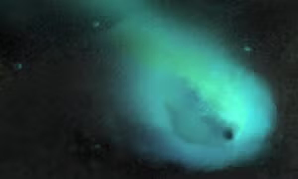 An artistic representation of Chiron’s nucleus surrounded by debris and a coma of dust and gas. 