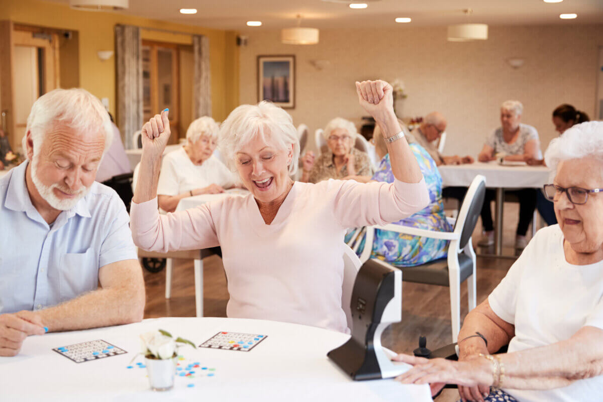 Senior woman winning game of bingo