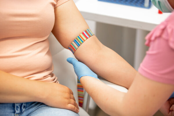 Woman having her blood drawn by a nurse