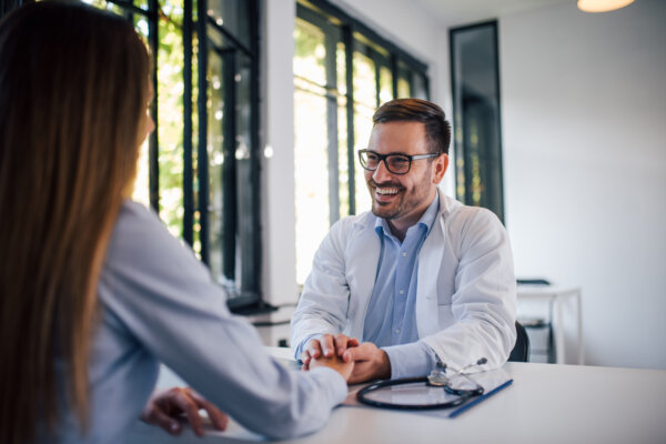 Doctor holding woman's hand while on a date