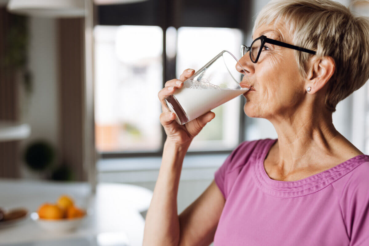 Woman drinking glass of milk