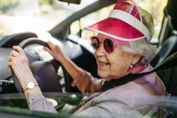 Elderly woman driving a car