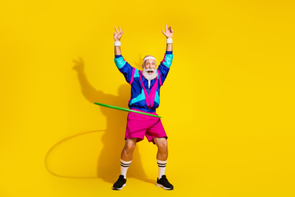 Older man excitedly hula-hooping