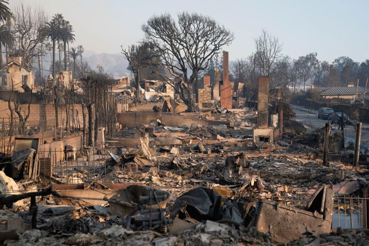 The charred remains of homes stand in the aftermath of the Palisades Fire