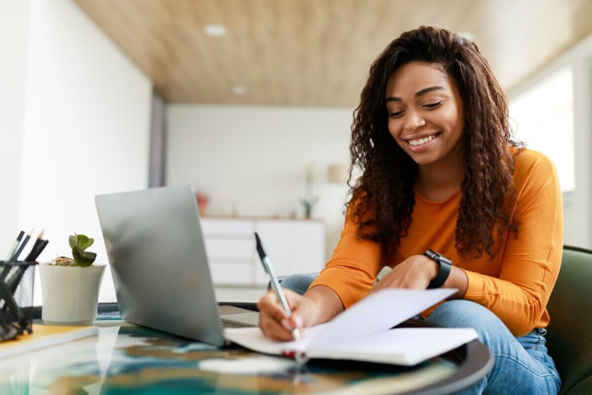 Girl happily doing homework or studying