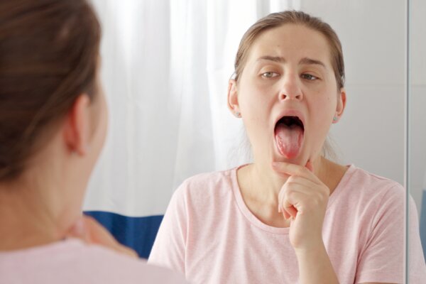 Woman checking her tongue and mouth
