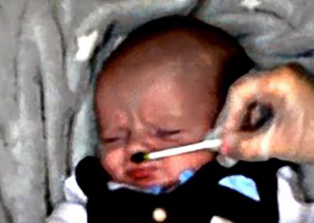 Crying baby reacting to veggies