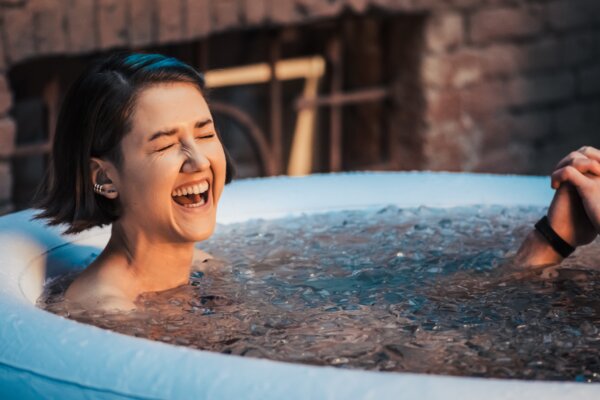 Woman laughs in ice bath