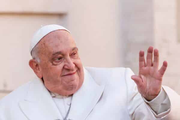 Pope Francis waves to the faithful as he arrives for his weekly general audience in St. Peter's Square, Vatican, December 4, 2024.