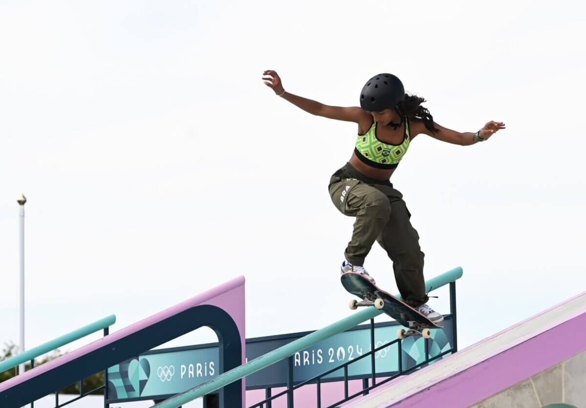 A skater grinding down a railing