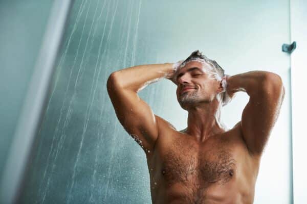 Man shampooing in the shower