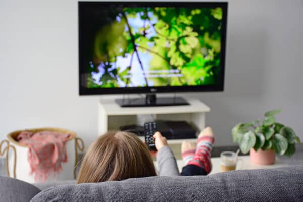 A woman watching a nature documentary
