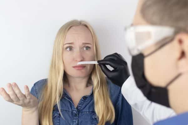 A doctor administering a smell test