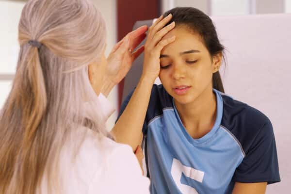Female soccer player with head injury or concussion
