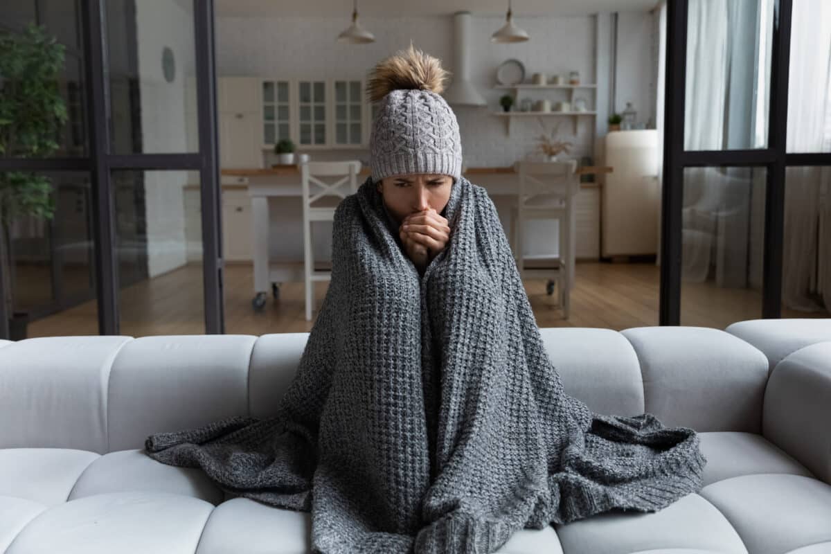 A woman freezing in a winter power outage